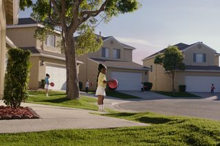 Children play outside in an ominous suburb in "A Wrinkle in Time" (2018).