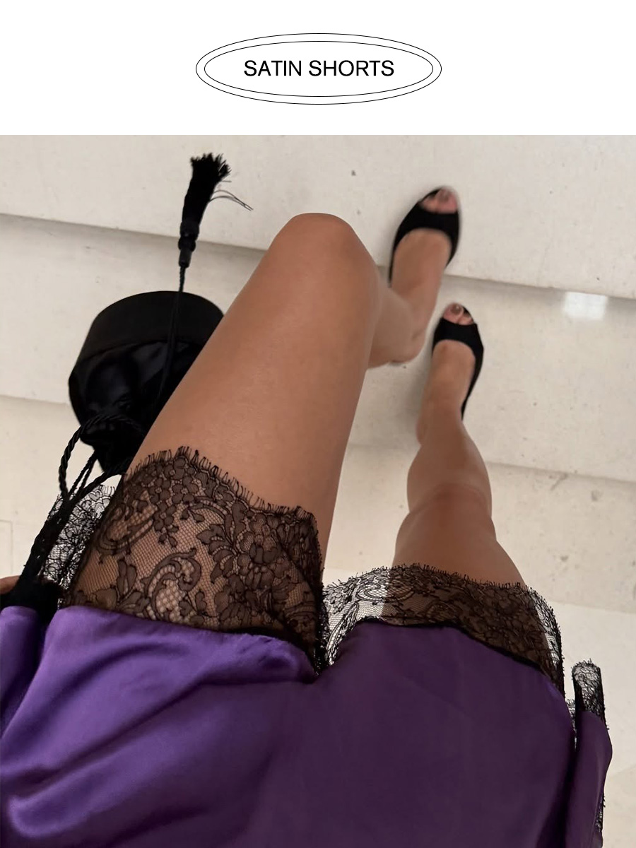 Influencer wearing purple satin shorts