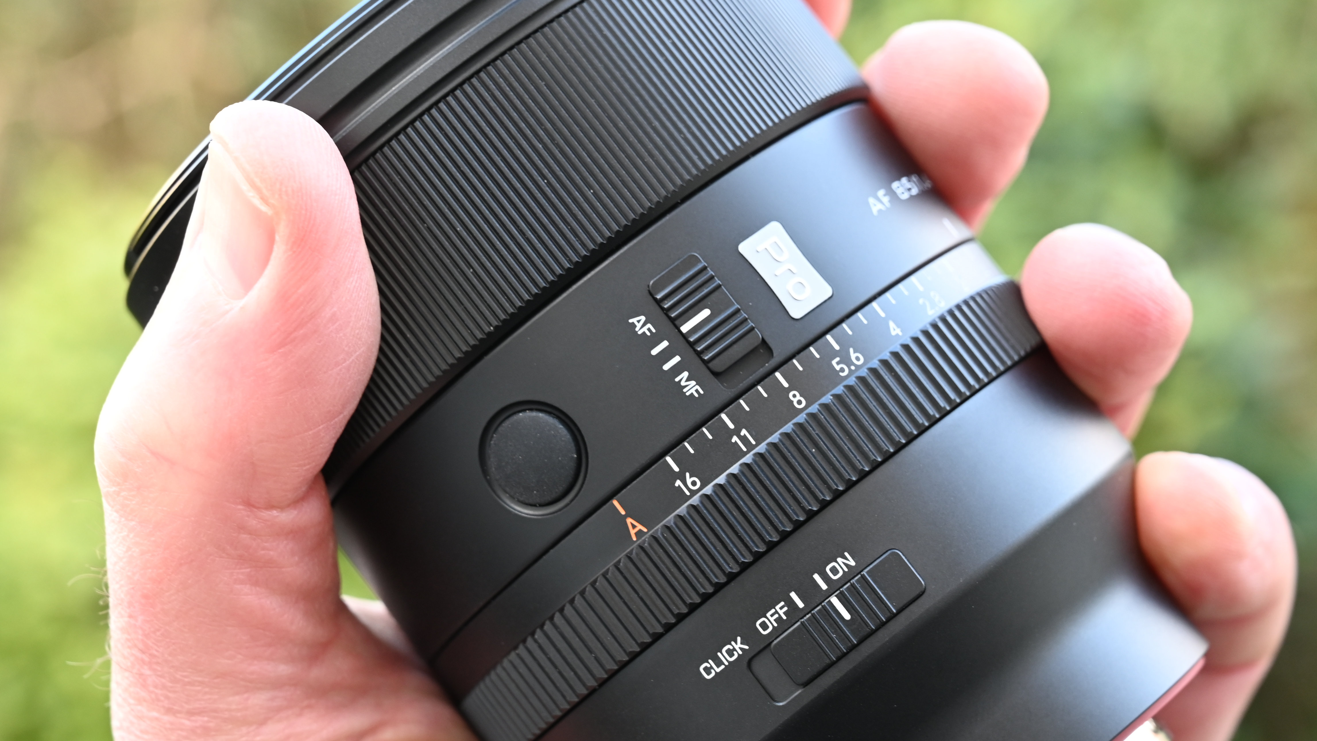 Viltrox AF 85mm f/1.4 Pro product shot, lens in hand