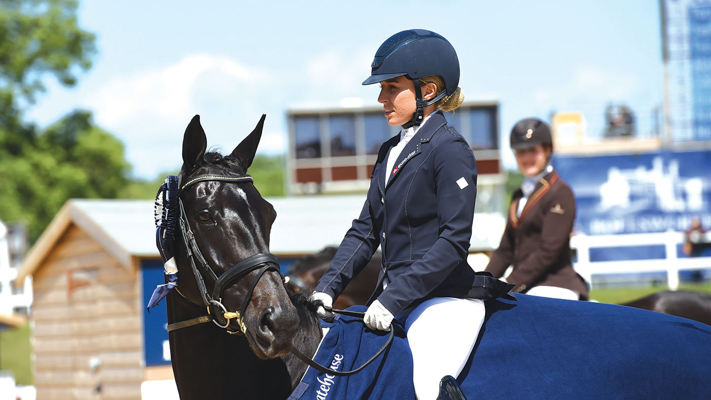 Amy Woodhead riding MSJ Zonetta (winner) during the lap of honour for the 5 year Old Dressage Championship at the Bolesworth International Horse Show near Chester in Cheshire in the UK on 14th May 2017