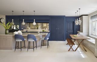a blue bespoke kitchen designed by martin moore