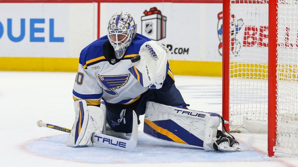 St. Louis Blues goalie Jordan Binnington (50) makes a glove save during the second period of an NHL regular season hockey game between the St. Louis Blues and the Detroit Red Wings, on the way the NHL Winter Classic 2025