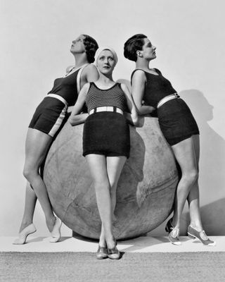 Erna Carise and models around a Michelin push-ball, 1930