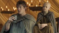 Dunk and Egg sitting next to each other on A Knight of the Seven Kingdoms.