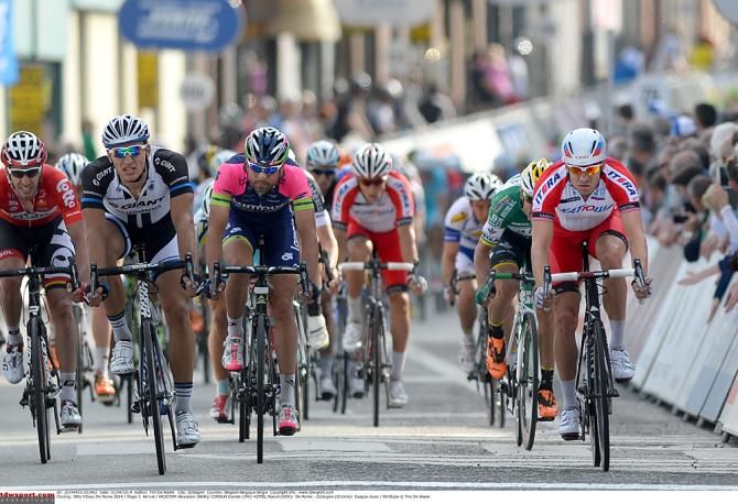 Marcel Kittel leads the peloton home in 14th place