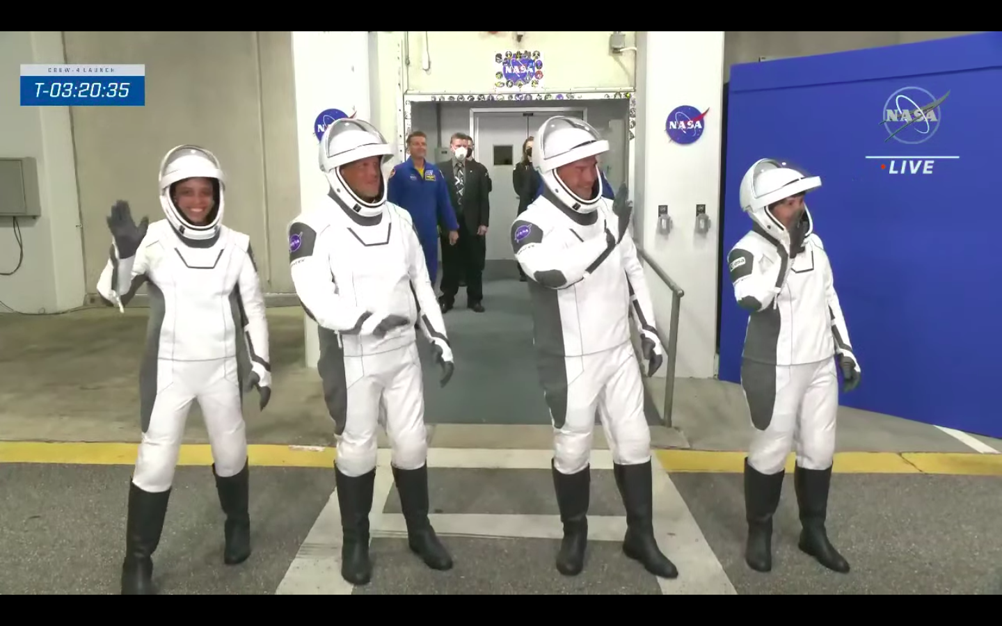 The Crew-4 astronauts walk out of the Neil Armstrong Operations and Checkout Building at NASA's Kennedy Space Center at about 12:30 a.m. EDT (0430 GMT) on April 27, 2022. They soon got into Teslas that drove them to KSC's Launch Pad 39A.