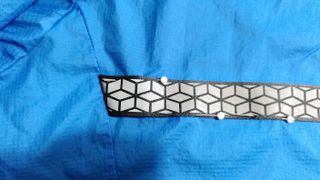 Sewing reflective tape onto a running jacket
