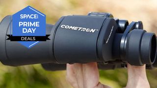 Cometron 7x50 binoculars being held in a hand with Space.com Prime Day badge in left corner.