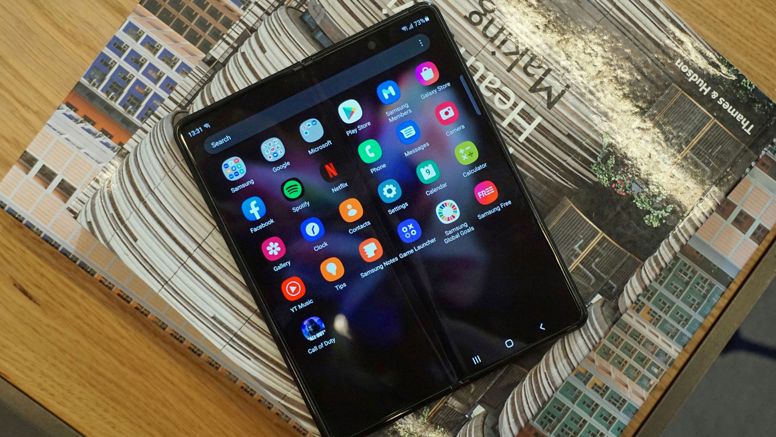 The Samsung Galaxy Z Fold 3 lying face up with the screen unfolded