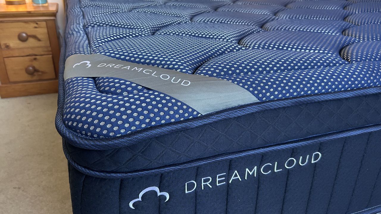 Close detail images of the DreamCloud Luxe Memory Foam mattress, showing design features like the quilted top of the bed and the handles sewn onto the sides
