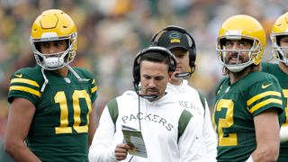 Jordan Love and Matt LaFleur in conversation with Aaron Rodgers when he was a Green Bay Packers player on October 24, 2021