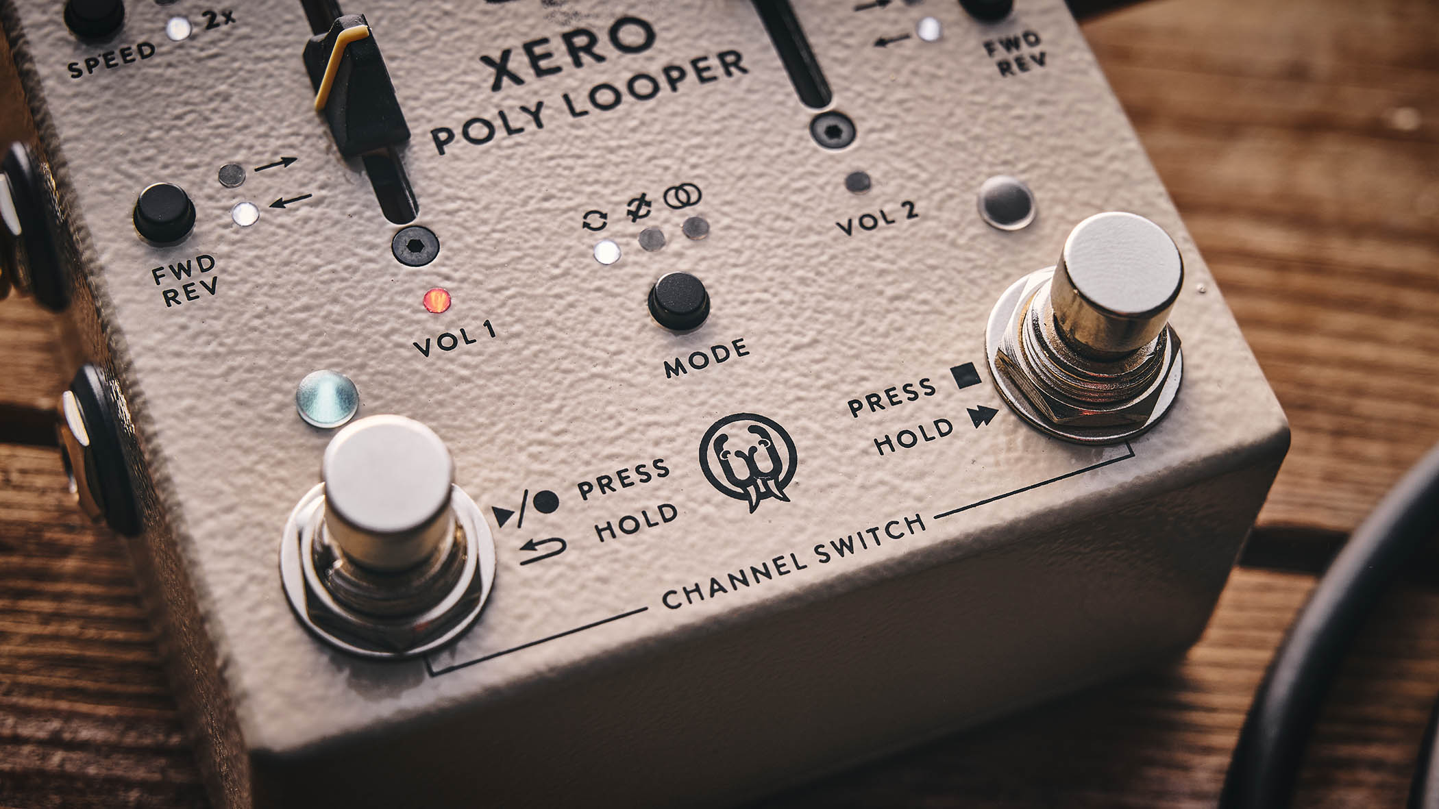 Walrus Audio Xero Polylooper: the dual-slider and footswitch looper is photogaphed against a wooden floor.