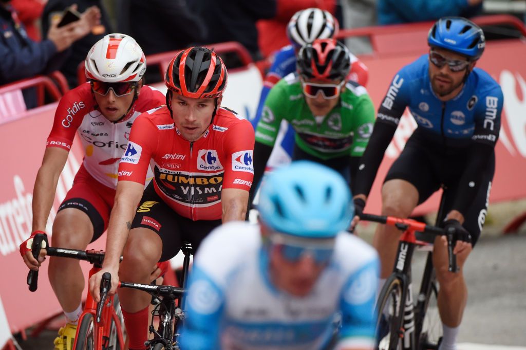 Team Jumbo rider Slovenias Primoz Roglic 2L crosses the finish line of the 14th stage of the 2020 La Vuelta cycling tour of Spain a 2047km race from Lugo to Ourense on November 4 2020 Photo by MIGUEL RIOPA AFP Photo by MIGUEL RIOPAAFP via Getty Images