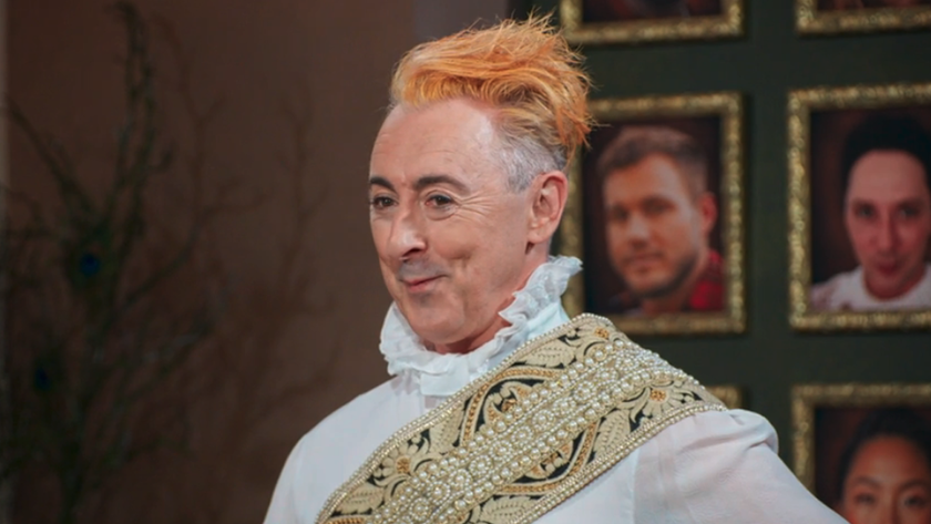 Alan Cumming with orange hair and a ruffle top at breakfast in The Traitors Season 4, episode 6