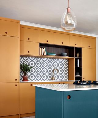 A yellow and walnut toned contemporary kitchen with open shelving and a pendant glass light