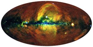 This false-color map shows the newfound X-ray bubbles (yellow and red) towering over the galactic center.
