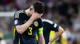 Why Euro 2024 has put Scotland at a MAJOR disadvantage in Group A: Andy Robertson looks dejected after Scotland's 5-1 defeat to Germany in their opening game at Euro 2024. 