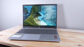 The HP Omnibook 5 Laptop AI on a wood table