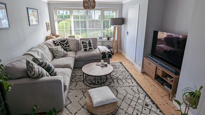 living room with rug and wooden floor