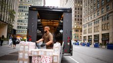 A UPS driver unloads his truck in New York City in August 2023.