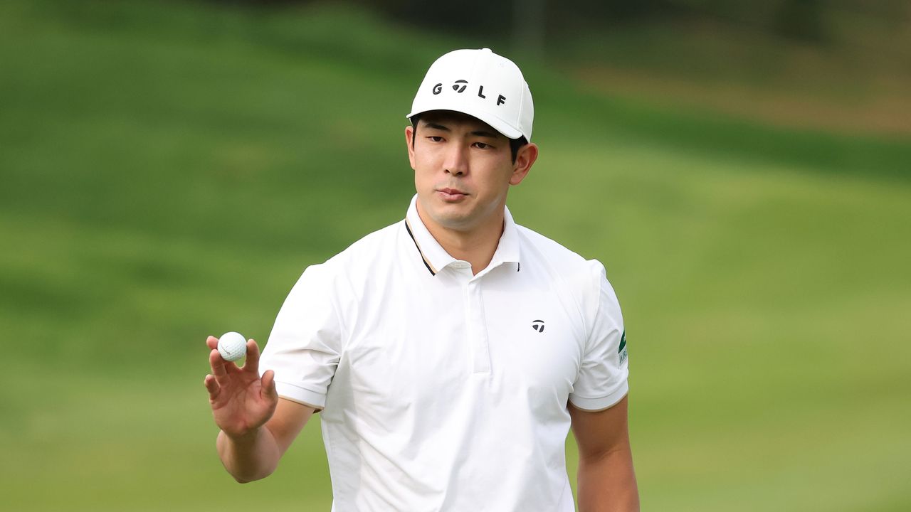 Keita Nakajima holds his golf ball up to the crowd at the 2024 Genesis Championship