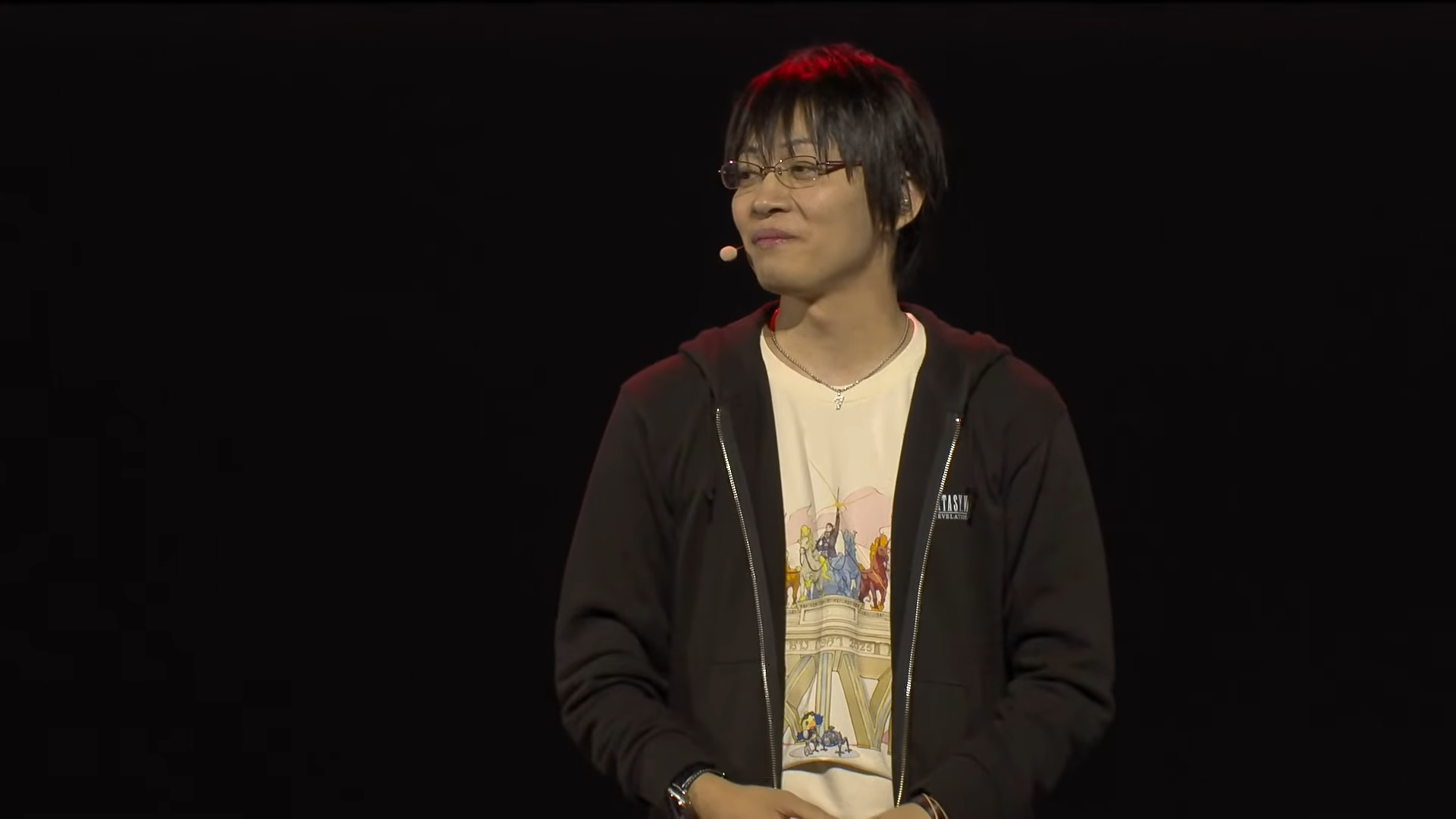Naoki Hamaguchi on stage during the keynote at the Berlin Final Fantasy 14 Fan Festival.