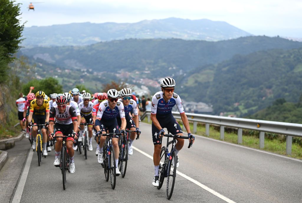 COLLU FANCUAYA SPAIN AUGUST 27 LR Jan Polanc of Slovenia and UAE Team Emirates Dries Devenyns of Belgium and Fausto Masnada of Italy and Team QuickStep Alpha Vinyl lead the peloton during the 77th Tour of Spain 2022 Stage 8 a 1534km stage from Pola de Laviana to Collu Fancuaya 1084m LaVuelta22 WorldTour on August 27 2022 in Collu Fancuaya Spain Photo by Justin SetterfieldGetty Images