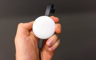 Google Chromecast in hand