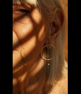 woman wears diamond earring