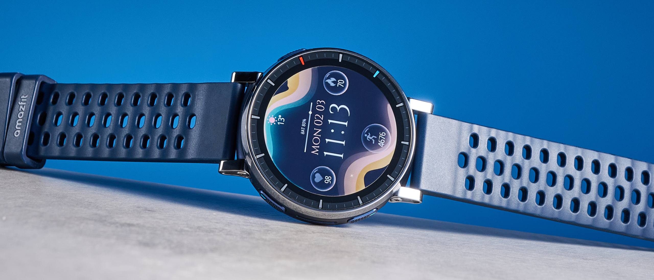 the amazfit active 3 premium photographed against the blue tom's guide background