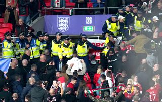 Hungary fans clash with police officers in the stands during October's World Cup qualifier at Wembley