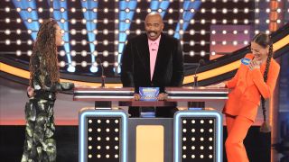 Steve Harvey with Jasmin Savoy Brown and Tawny Cypress on Celebrity Family Feud