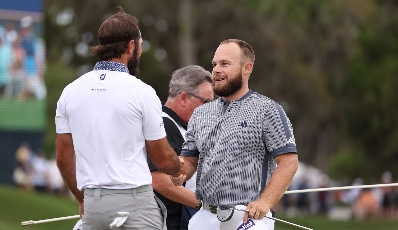 Max Homa and Tyrrell Hatton shake hands