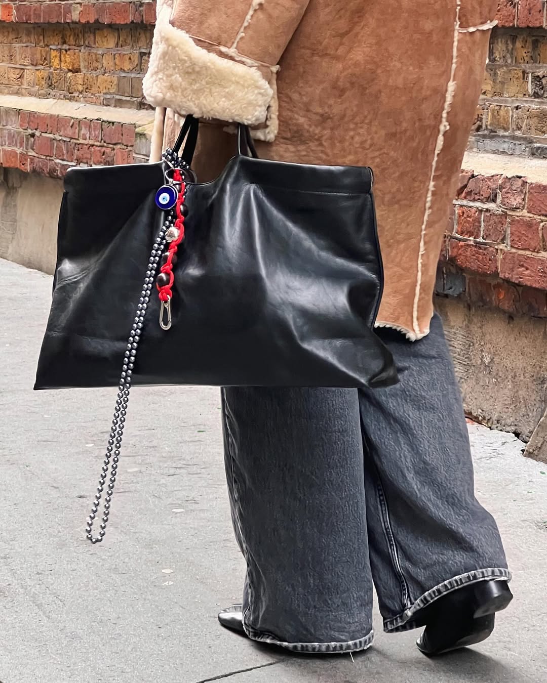 Sophia in dark jeans and black boots