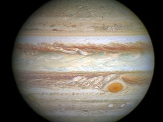 This spectacular image by NASA's Hubble Space Telescope shows Jupiter's trademark Great Red Spot — a swirling storm larger than Earth.