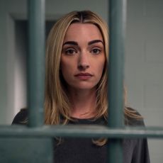 A woman is seen through prison bars, in 'Ginny and Georgia' season 3.