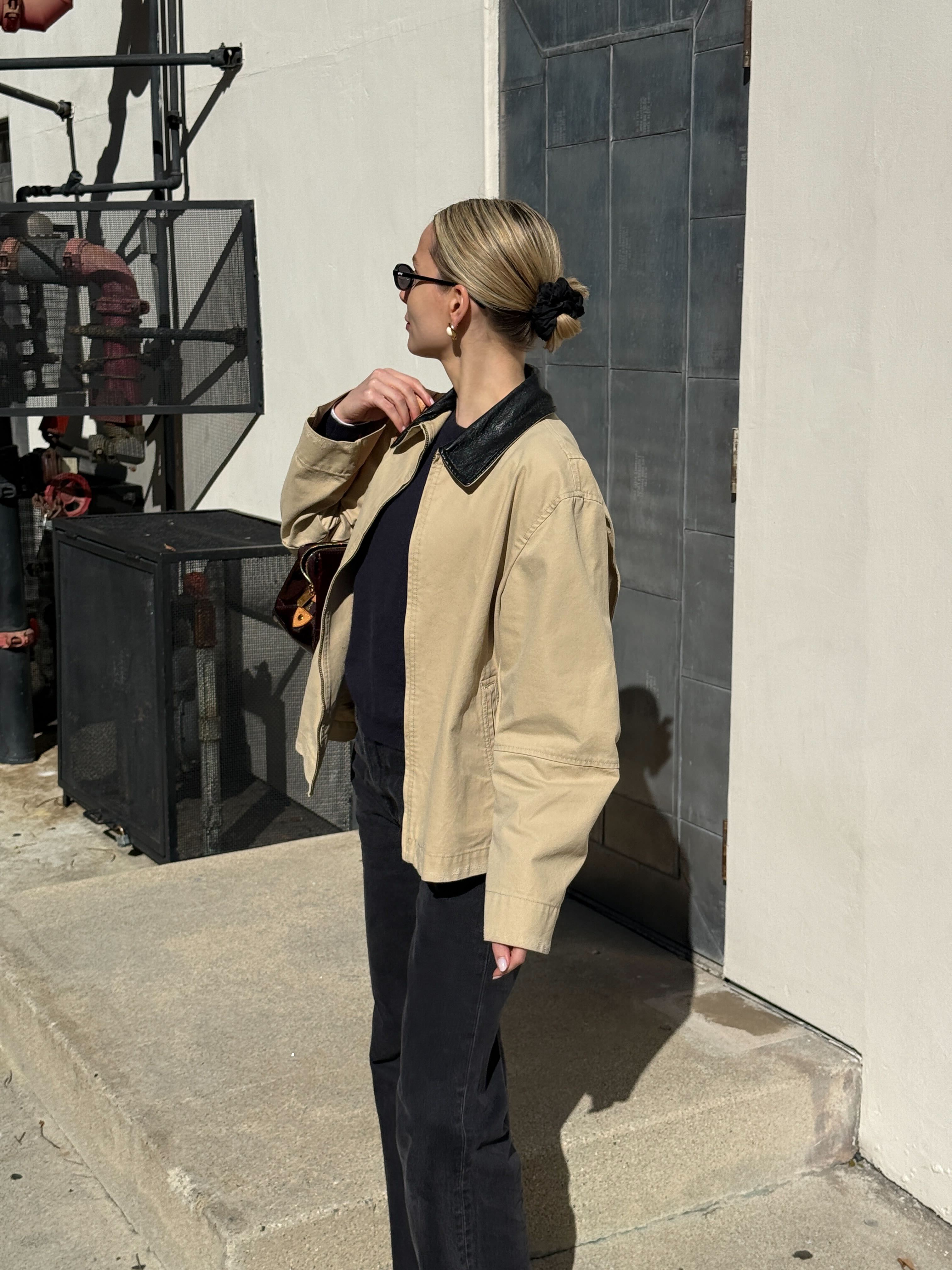 Image of Emma Hughes' slicked back bun.