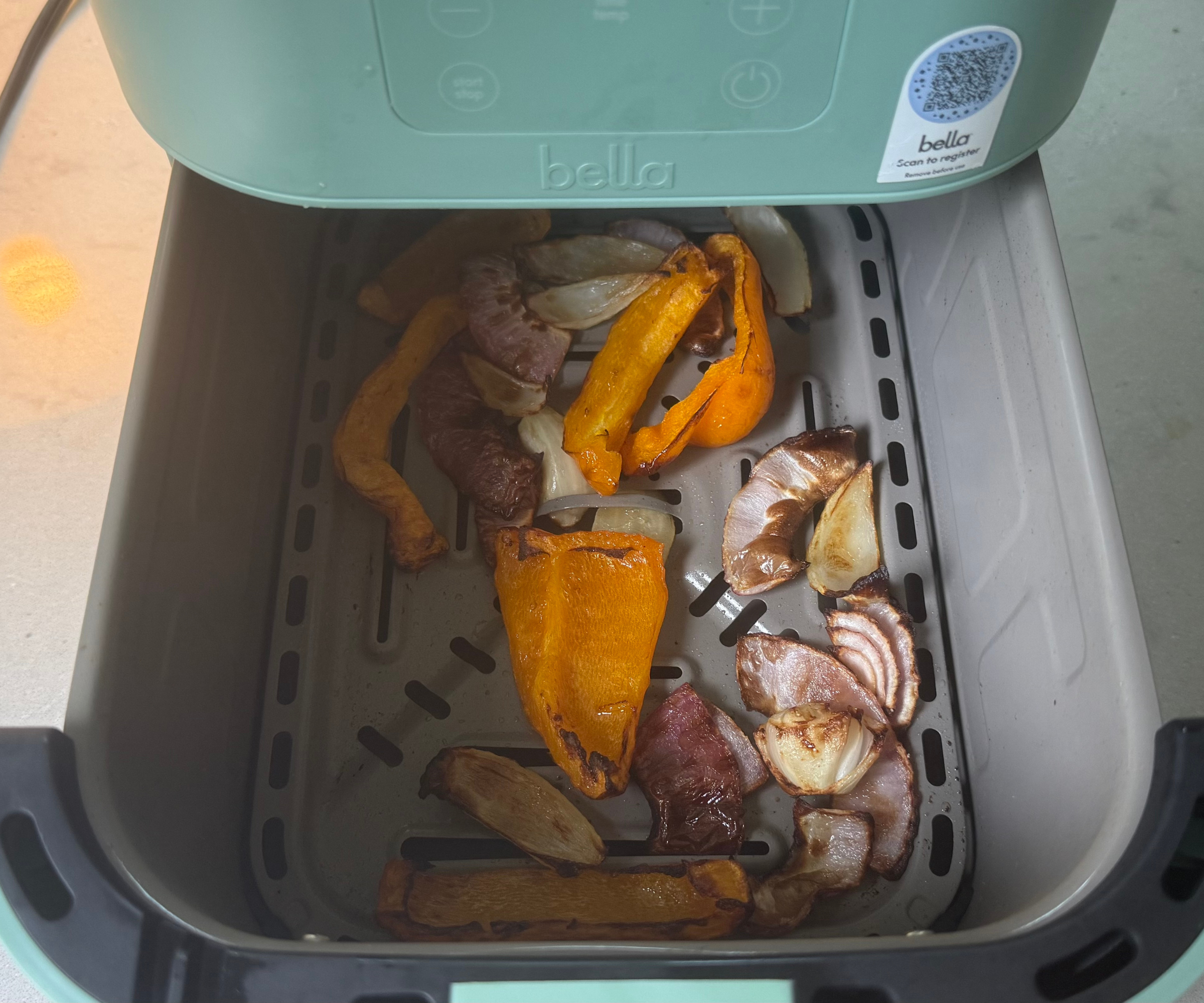 Roasted veggies in the Bella FitsAnywhere 4QT Air Fryer in the test kitchen