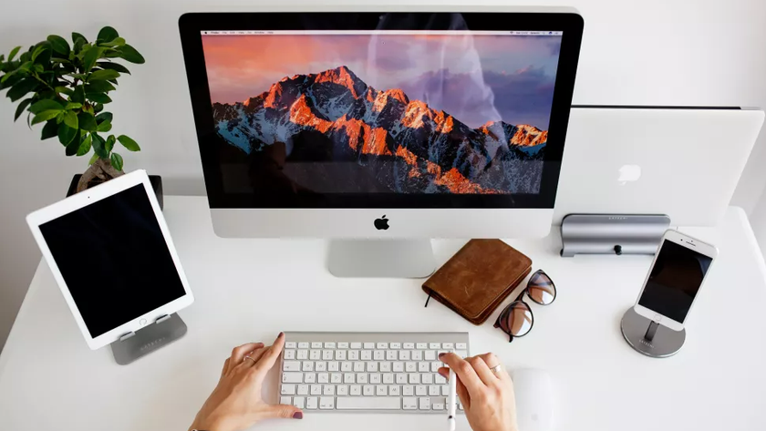 Apple devices being used at a desk