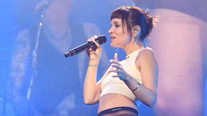 Lily Allen singing on stage