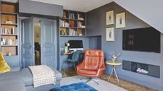 Blue living room with TV and computer