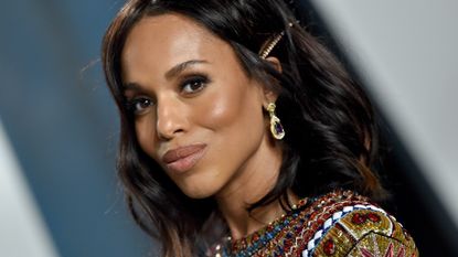 kerry washington wearing earrings and colourful dress