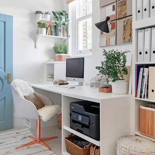modern home office ideas, home office with neutral storage, white desk and storage units, basket, pale blue painted door
