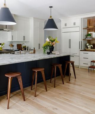 Blue and white kitchen with wooden kitchen flooring