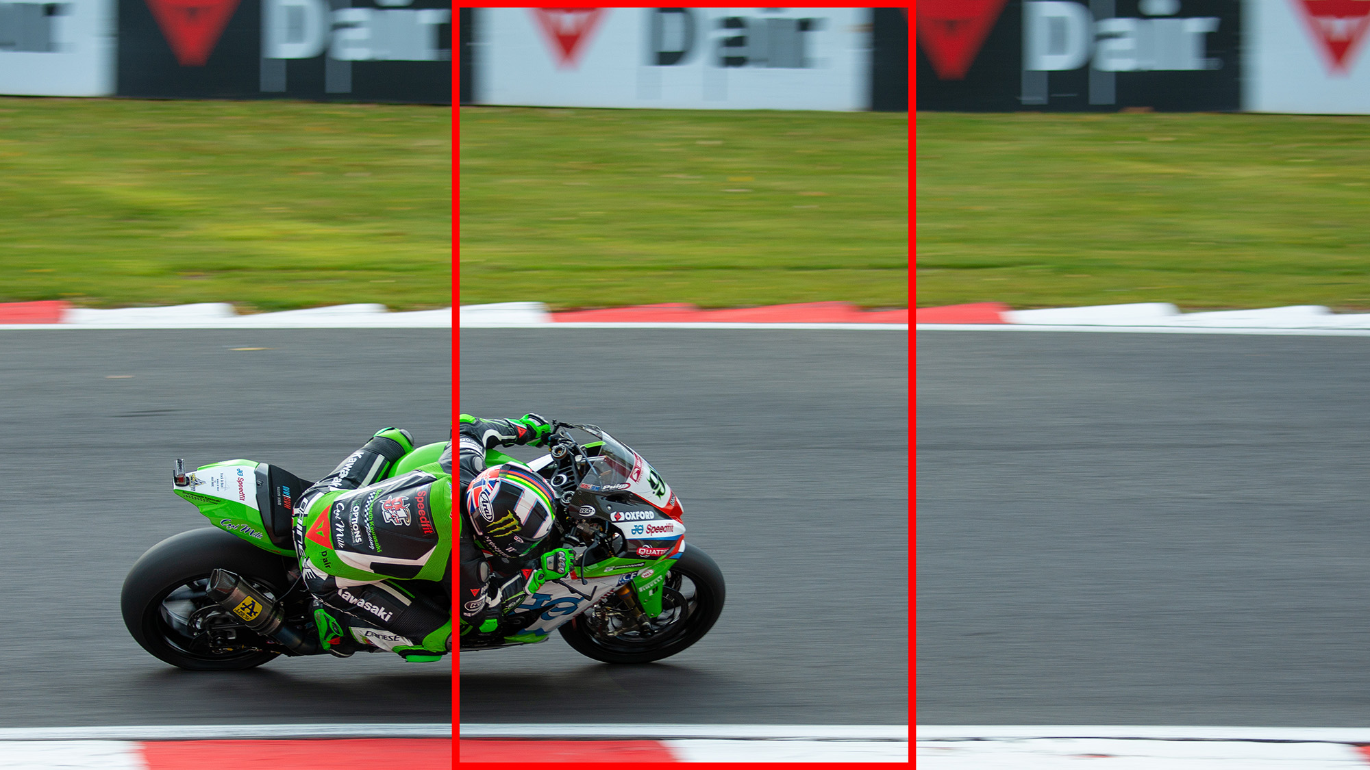 Motorbike panning shot with red rectangle showing vertical video crop 