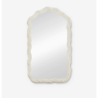 slightly arched mirror with a cream ridged free-flowing wavy border