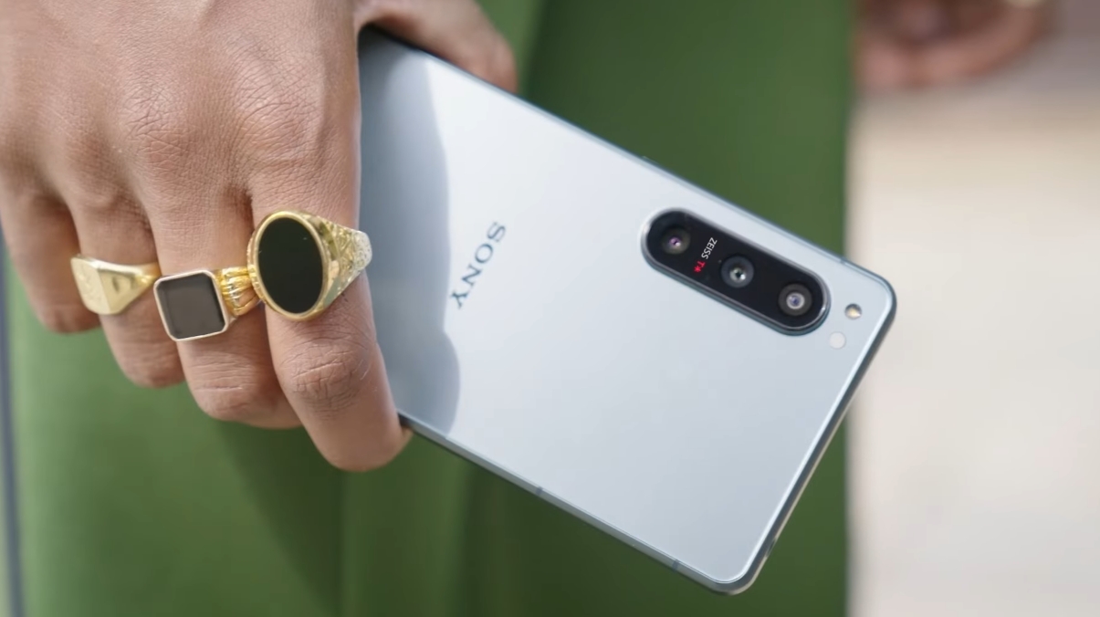 A Sony Xperia 5 IV in the back, in someone's hand