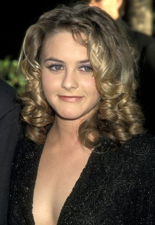 Alicia Silverstone with corkscrew curls for embarrassing hair trends from the '90s round-up
