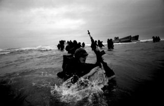 United States Marines wade ashore at Tam Ky during Operation Colorado. Central Vietnam, 1965. (Photo by © Tim Page/CORBIS/Corbis via Getty Images)