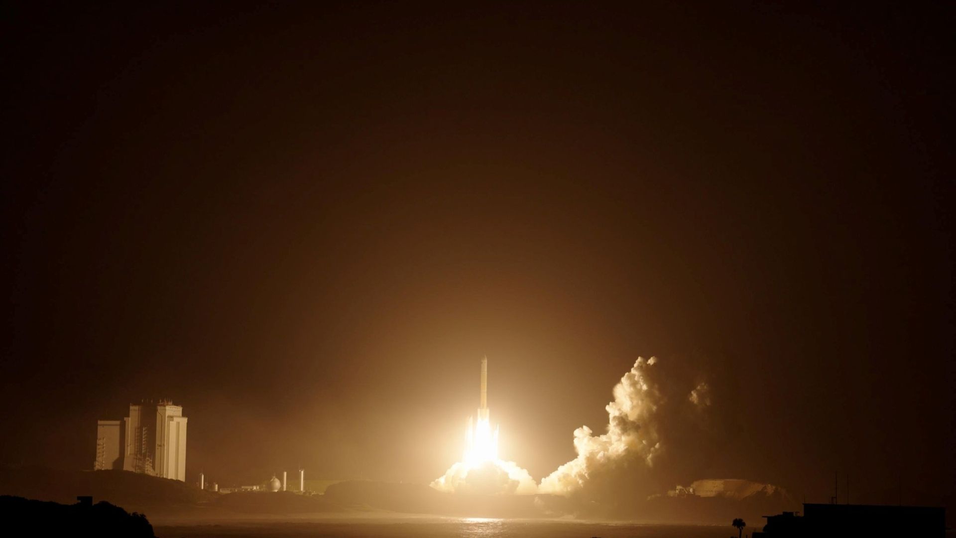 A photo of the H3 rocket launching into space at night on Oct. 19